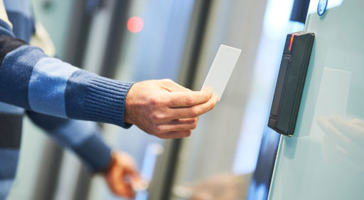 Person using a key card & Access Control Systems