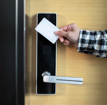 Person opening a door using a Smart card access control system