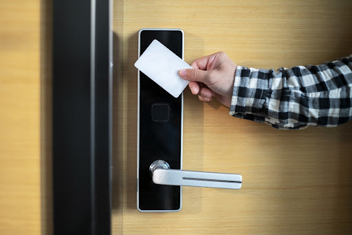 Person opening a door using a Smart card access control system