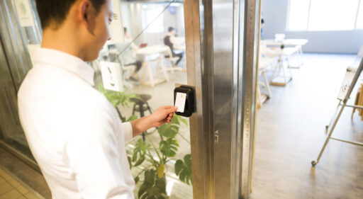 Employee using card to activate the access control system